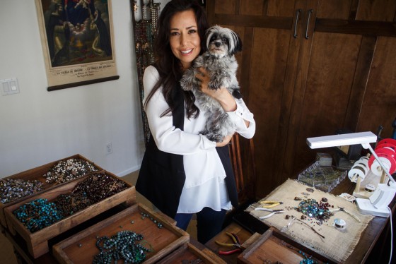 Rosary designer Arasely Rios with her dog Luna in her Temecula studio. Rios is crafting a rosary for Pope Francis which he will receive upon his arrival to the U.S. on Sept. 22. Photo by Shane Gibson
